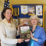 President Caryl accepts plaque from Albany Little League